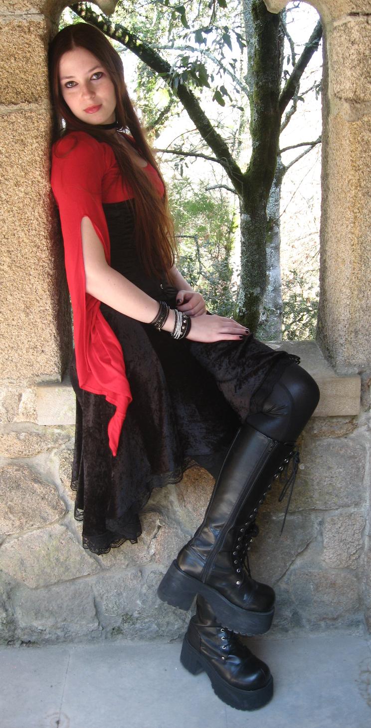 Auburn Gothic Girl wearing Black Leather Pants and Red and Black Dress